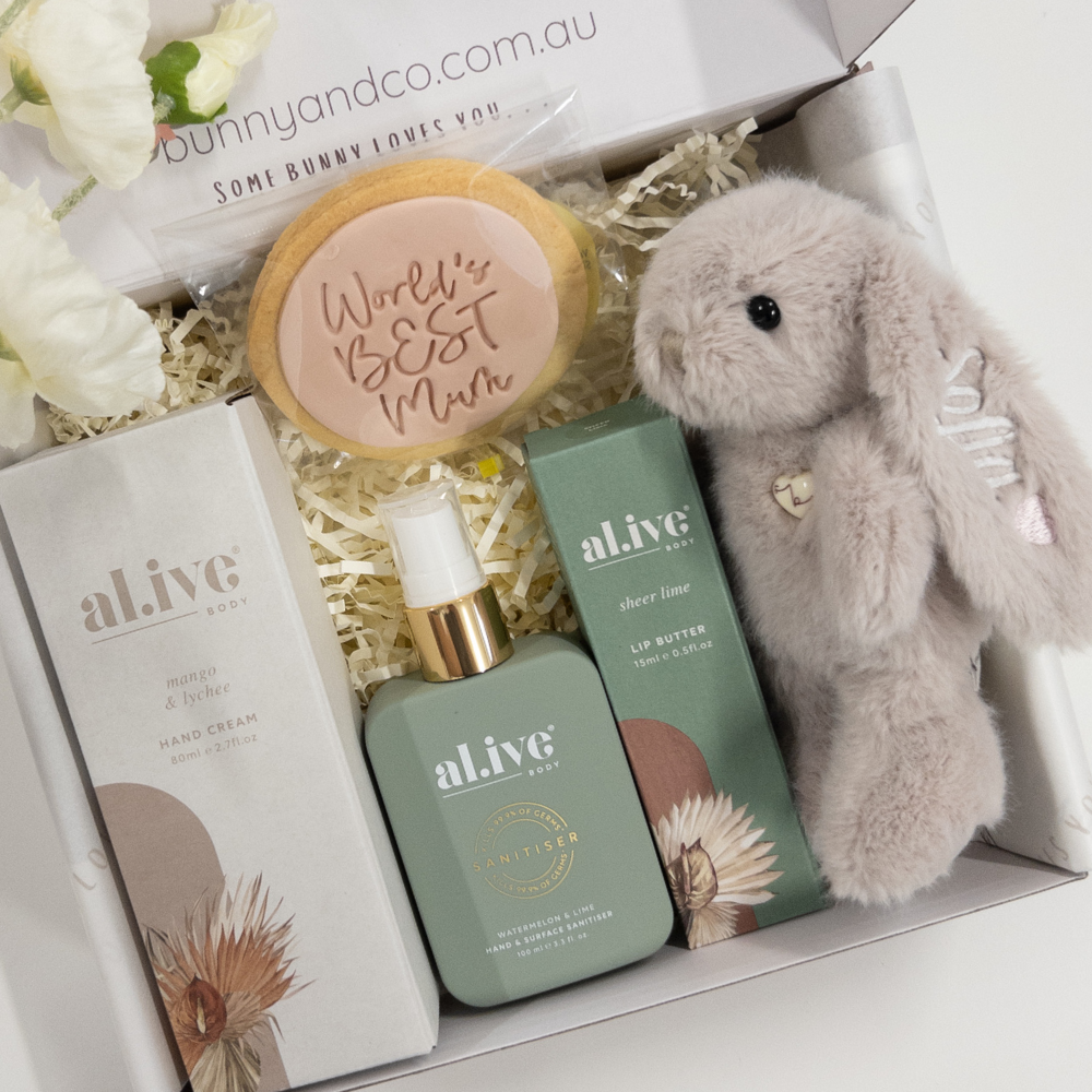 New mum and bub Gift set with 'al.ive' skincare products, a personalised plush bunny, and a cookie in a box.