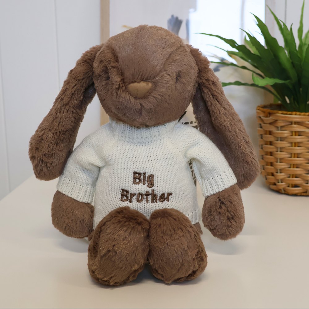 Brown Jamie Kay Snuggle Bunnies plush bunny wearing a sweater with 'Big Brother' text 