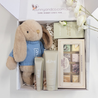 Gift set with personalised plush bunny wearing jumper, gifts and treats for new mum, featuring Bunnyandco.com.au branding.