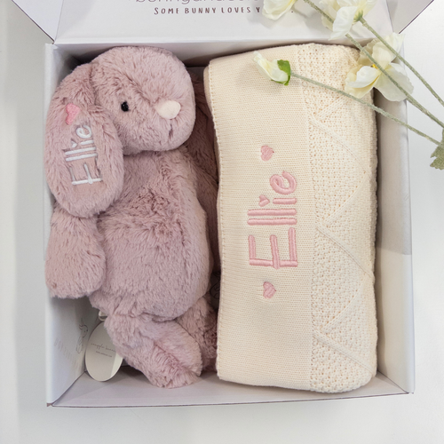 Pink stuffed bunny and cream blanket with 'Elle' embroidery in a box.