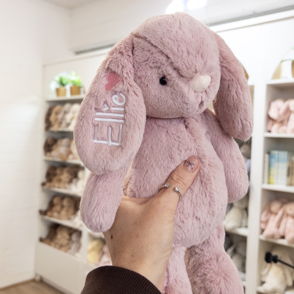 Pink plush personalised bunny toy with name and heart on ear. Personalised infant baby gift Australia
